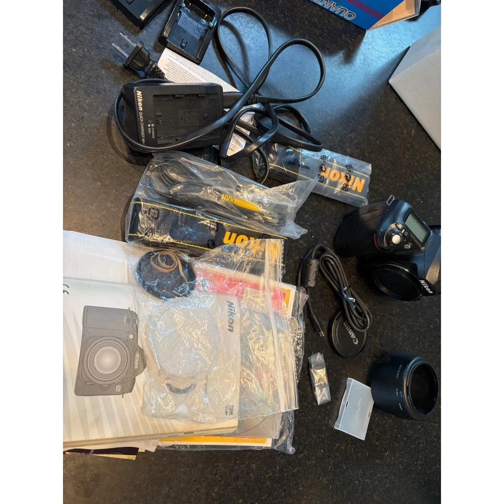 Nikon D50 DSLR camera with accessories charger, strap, cables, manual lens